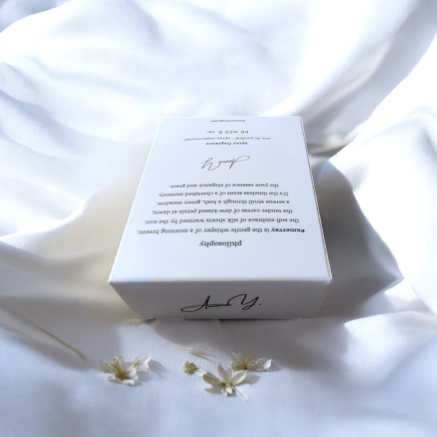a white box sitting on top of a white sheet
