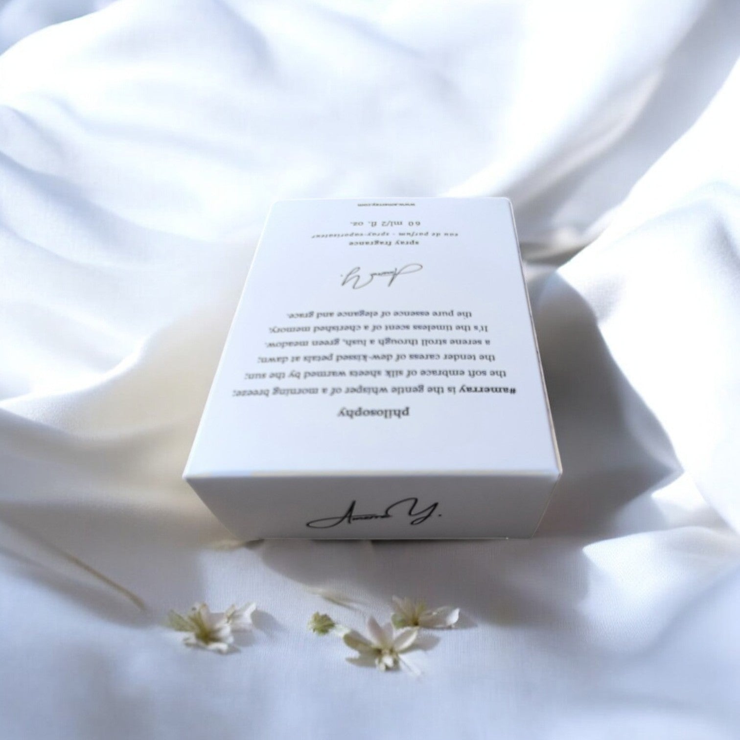 a white box sitting on top of a white sheet